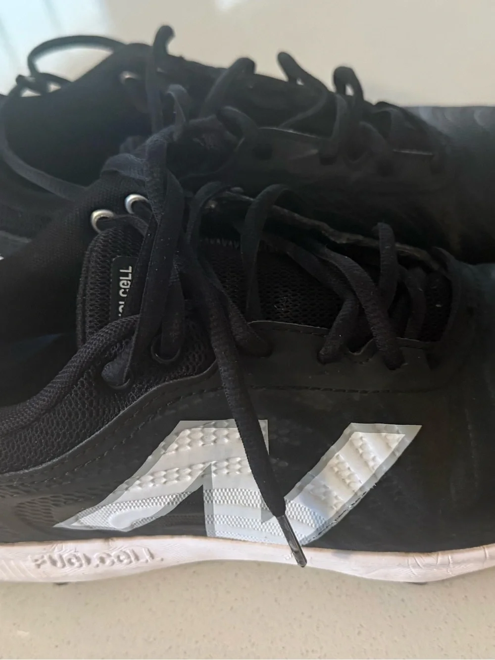Black NB Cleats with White Insole Lettering great shape like new size M 8.5 W 10
